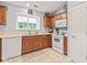Charming kitchen with wood cabinets, white appliances, and bright natural light at 1605 Leisure Way, Greenfield, IN 46140