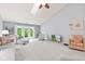 Spacious living room with vaulted ceiling, skylight, and access to the backyard at 1605 Leisure Way, Greenfield, IN 46140