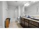 Functional bathroom with a shower/tub combo, vanity, and neutral flooring at 2017 Shadow Creek Blvd, Columbus, IN 47201