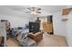 Spacious bedroom with ceiling fan, carpet, and a window for natural light at 2017 Shadow Creek Blvd, Columbus, IN 47201
