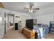 Bright bedroom features a ceiling fan, closet, and an open doorway at 2017 Shadow Creek Blvd, Columbus, IN 47201