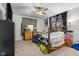 Bedroom with ceiling fan and natural wood frame bed at 2017 Shadow Creek Blvd, Columbus, IN 47201