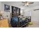 Bedroom with ceiling fan, natural wood frame bed, and decor at 2017 Shadow Creek Blvd, Columbus, IN 47201