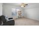 This bedroom features a comfortable recliner and a charming display shelf at 2017 Shadow Creek Blvd, Columbus, IN 47201