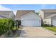 Exterior of a home featuring a large two car garage and an extended driveway for extra parking at 2017 Shadow Creek Blvd, Columbus, IN 47201