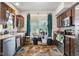 Charming kitchen with stainless steel appliances, dark wood cabinets, and eye-catching tile flooring at 2017 Shadow Creek Blvd, Columbus, IN 47201