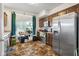 Well-lit kitchen featuring stainless steel appliances, dark wood cabinets and a stainless steel fridge at 2017 Shadow Creek Blvd, Columbus, IN 47201