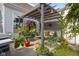 A charming patio area with a pergola, comfortable seating, and lush plants at 2017 Shadow Creek Blvd, Columbus, IN 47201