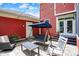 Inviting backyard featuring a patio, string lights, seating, and red exterior at 2263 Glebe St, Carmel, IN 46032