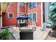 Inviting backyard features a red exterior, cozy seating with patio and string lights at 2263 Glebe St, Carmel, IN 46032