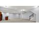 Finished basement area with neutral walls and carpet with stairs and a wet bar area at 2263 Glebe St, Carmel, IN 46032