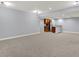 Large finished basement featuring plush carpet, recessed lighting, and a wet bar area at 2263 Glebe St, Carmel, IN 46032