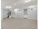Finished basement area, offering ample space with recessed lighting and storage cabinets at 2263 Glebe St, Carmel, IN 46032