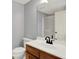 Bathroom featuring a vanity with wood cabinets, white countertop, and black faucet at 2263 Glebe St, Carmel, IN 46032
