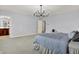 Bedroom with plush carpeting, neutral paint and access to bathroom at 2263 Glebe St, Carmel, IN 46032