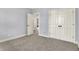 Spacious bedroom with carpeted floors, neutral paint, and a double door closet at 2263 Glebe St, Carmel, IN 46032