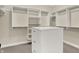 Walk-in closet with custom white shelving at 2263 Glebe St, Carmel, IN 46032