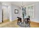 Charming dining area with hardwood floors, natural light, and a modern chandelier at 2263 Glebe St, Carmel, IN 46032