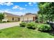 Exterior view of home featuring a large lawn, manicured landscaping and three-car garage at 2263 Glebe St, Carmel, IN 46032