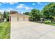 Spacious three-car garage with a wide driveway and lush landscaping at 2263 Glebe St, Carmel, IN 46032