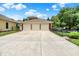 Spacious three-car garage with a wide driveway and well-maintained landscaping at 2263 Glebe St, Carmel, IN 46032