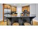 Well-lit kitchen features stainless steel appliances, granite countertops, and a central island with bar seating at 2263 Glebe St, Carmel, IN 46032