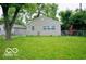 This is a shot of the exterior of a house with a large grassy lawn at 2305 Barnor Dr, Indianapolis, IN 46219