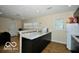 Kitchen showcasing dark cabinetry, granite countertops, and open-concept design at 2305 Barnor Dr, Indianapolis, IN 46219