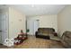 Living room featuring neutral walls, wood-look floors, and plush couches at 2305 Barnor Dr, Indianapolis, IN 46219