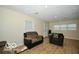 Living room with neutral walls, wood-look floors, and comfortable seating at 2305 Barnor Dr, Indianapolis, IN 46219