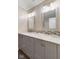 Bathroom with double vanity, updated mirrors, and modern fixtures at 2750 Chamberlin Dr, Indianapolis, IN 46227