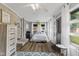 Cozy bedroom with lots of light, wood floors and door leading to the exterior at 2750 Chamberlin Dr, Indianapolis, IN 46227
