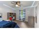 Cozy bedroom with blue accents, a ceiling fan, and natural light at 2750 Chamberlin Dr, Indianapolis, IN 46227