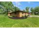Brick home with well-maintained landscaping, showcasing curb appeal and a spacious yard at 2750 Chamberlin Dr, Indianapolis, IN 46227
