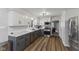 Modern kitchen features stainless steel appliances, white subway tile backsplash and marble countertops at 2750 Chamberlin Dr, Indianapolis, IN 46227