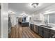 Modern kitchen with stainless steel appliances, sleek countertops, and open layout to dining area at 2750 Chamberlin Dr, Indianapolis, IN 46227