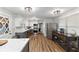 Spacious kitchen with stainless steel appliances, wood flooring and island with marble countertops at 2750 Chamberlin Dr, Indianapolis, IN 46227