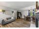 Inviting living room with new floors, cozy furniture, and fireplace at 2750 Chamberlin Dr, Indianapolis, IN 46227