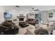 Inviting living room featuring a stone fireplace, comfortable seating, and ample natural light at 2750 Chamberlin Dr, Indianapolis, IN 46227