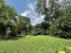 Expansive backyard with lush greenery and trees, offering a private and serene outdoor retreat at 2922 E 62Nd St, Indianapolis, IN 46220