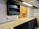 Basement featuring a utility cabinet and counter, perfect for additional storage or projects at 2922 E 62Nd St, Indianapolis, IN 46220
