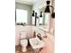 Charming powder room with beadboard walls, a vintage sink, and stylish lighting at 2922 E 62Nd St, Indianapolis, IN 46220