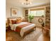 Stylish bedroom with neutral tones, hardwood floors, and natural light from the window at 2922 E 62Nd St, Indianapolis, IN 46220