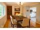 Traditional dining room featuring a wood table, four chairs, and a fireplace at 2922 E 62Nd St, Indianapolis, IN 46220