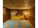 Spacious room with decorative mural wall and yoga mats, perfect for workouts or peaceful relaxation at 2922 E 62Nd St, Indianapolis, IN 46220