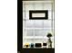Close up of a glass block window with candle decor providing natural light and design element at 2922 E 62Nd St, Indianapolis, IN 46220