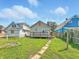 A spacious backyard with a wooden deck and grassy area at 3042 Newton Ave, Indianapolis, IN 46201