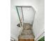 Stairway leading to the basement features textured walls and a door, offering potential at 3042 Newton Ave, Indianapolis, IN 46201