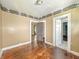 Spacious bedroom with wood floors, two closets, and vintage-themed wallpaper border at 3042 Newton Ave, Indianapolis, IN 46201