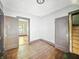 Empty bedroom with wood floors, doors, and classic trim awaiting personalization and style at 3042 Newton Ave, Indianapolis, IN 46201